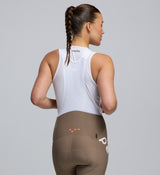 Close-up of Women’s SuperFit 2.0 Bib Tight in Stone showing premium Italian fabric, chamois, and reflective details