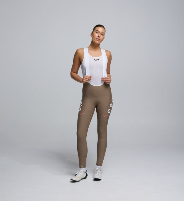 Front view of Pedla’s Women’s SuperFit 2.0 Bib Tight in Stone highlighting sleek design and high-quality construction