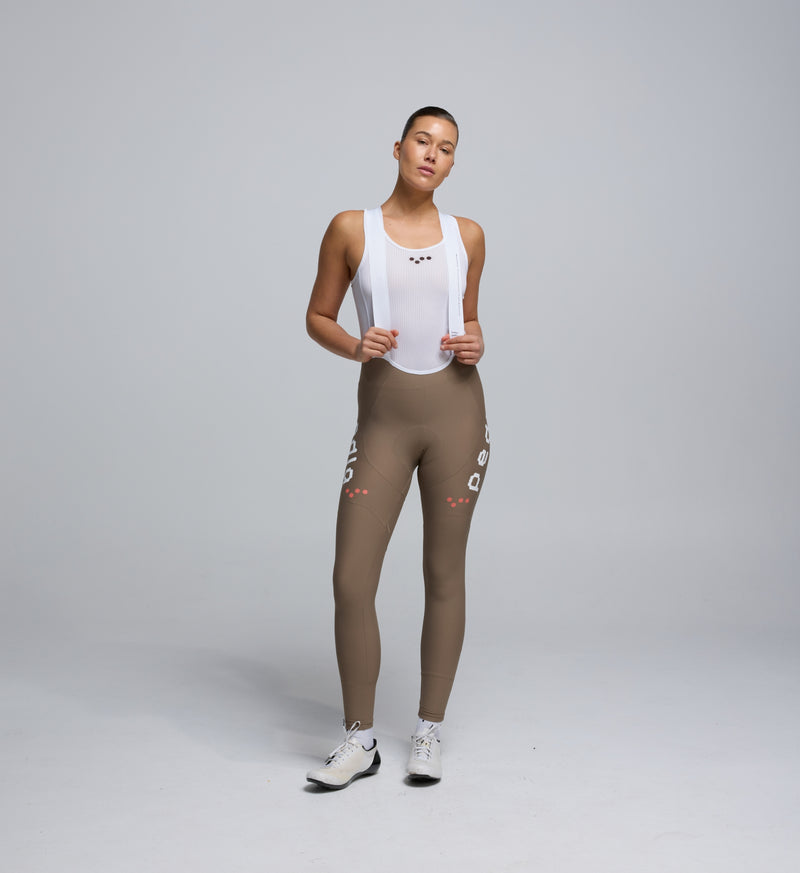 Front view of Pedla’s Women’s SuperFit 2.0 Bib Tight in Stone highlighting sleek design and high-quality construction