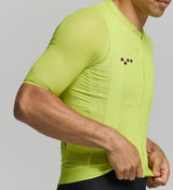 Close-up of mesh sleeve and lightweight jersey fabric – moisture-wicking texture with UPF-rated coverage and precision seam detailing for hot summer cycling comfort.
