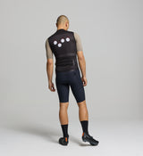 Rear image of black cycling gilet for men – featuring mesh back for ventilation, three reinforced rear pockets for essentials, and reflective logo for added visibility.