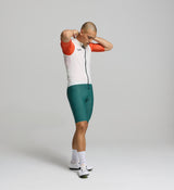 Side profile of porcelain men’s cycling vest – technical construction with elasticated armholes, mesh rear panel, and streamlined shape for movement and breathability.