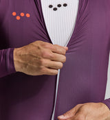 Close-up of lightweight aubergine fabric and mesh panels – breathable, sweat-wicking construction with soft seams and UPF 15+ sun coverage ideal for high-output riding.