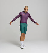 Front view of male cyclist in aubergine Air Long Sleeve Jersey – slim performance fit with mesh panels on the chest and sleeves for airflow and cooling on hot rides.