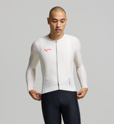 Front view of male cyclist in almond Classic Long Sleeve Jersey – sleek, close fit with extended sleeves and a low-profile collar for all-day riding performance.