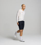 Side profile of almond men’s long sleeve cycling jersey – contoured fit with ventilation side panels and stretch fabric designed for endurance and seasonal versatility.