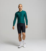 Front view of male cyclist in pine Classic Long Sleeve Jersey – sleek silhouette with extended sleeves, low-profile collar, and performance fit for versatile training.