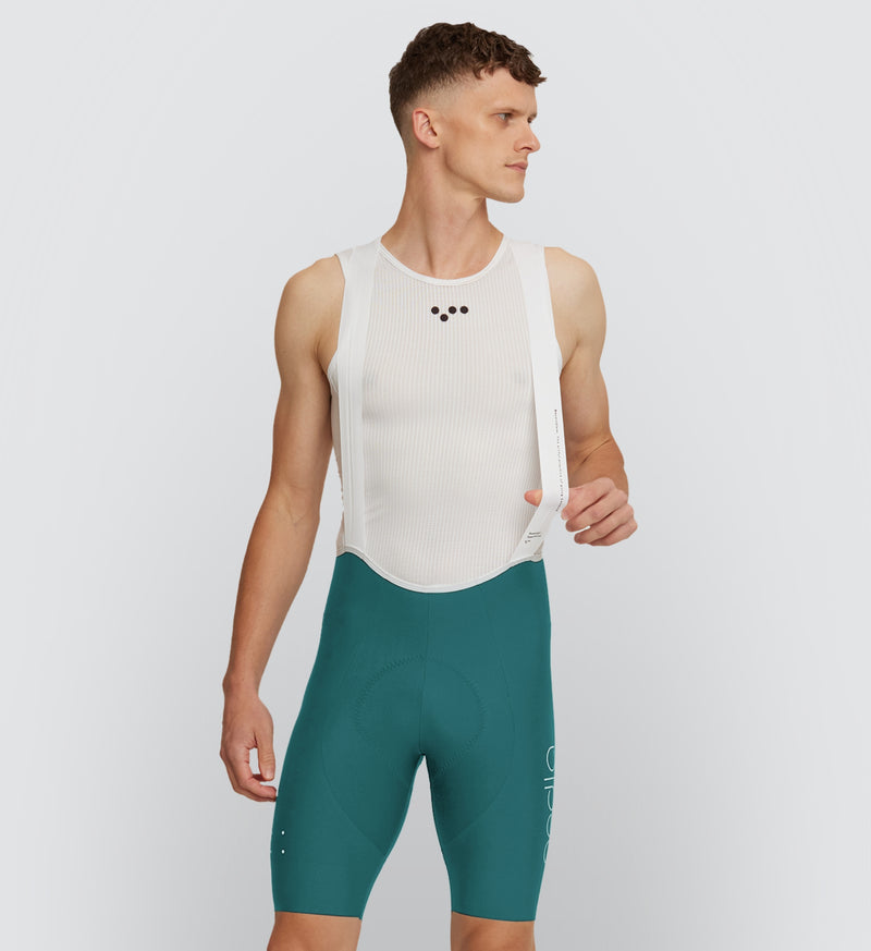 Front view of cyclist wearing Evergreen SuperFIT 2.0 Bib Shorts, highlighting the aerodynamic fit and muscle support