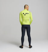 Rear view of electric lime cycling gilet – large concealed zip pocket, reflective rear logo, and weather-resistant membrane fabric ideal for low-light winter conditions.