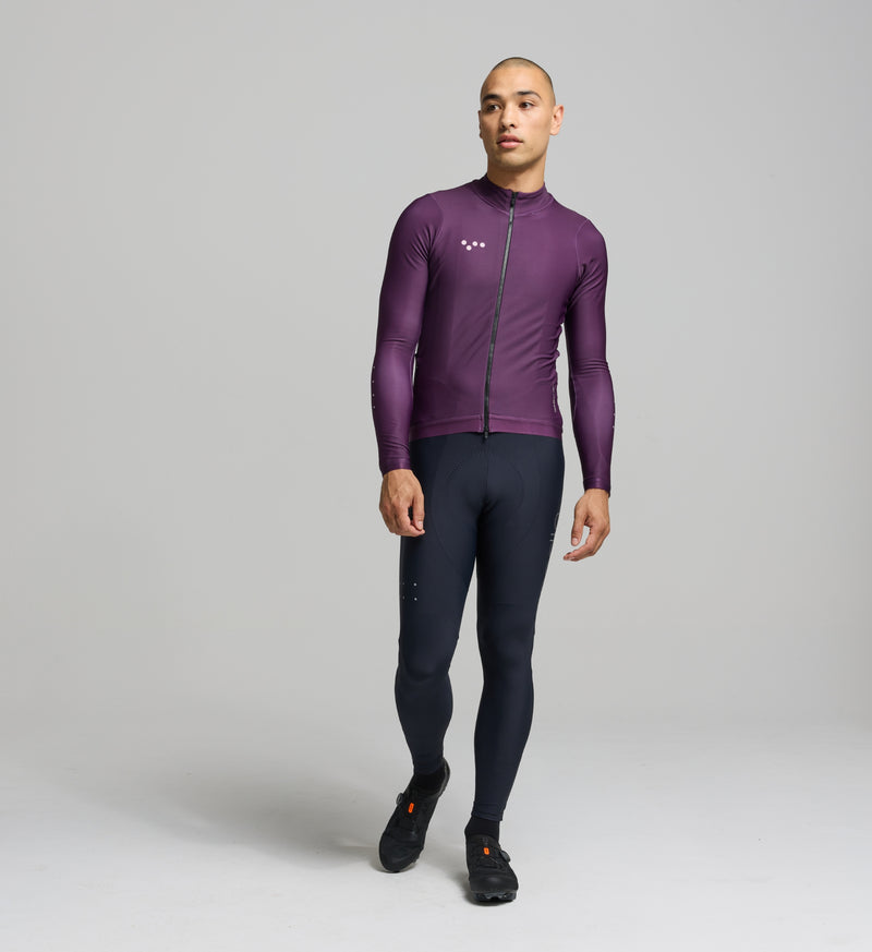 Front view of male cyclist in aubergine Thermal Jersey – close-fit, articulated sleeve design with performance-focused warmth and moisture control for winter training.