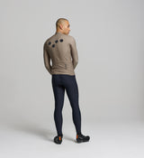 Back view of sandstone winter cycling jersey – featuring four-pocket design with side-wrap access, reflective rear details, and a silicone hem gripper for stability.