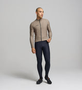 Front view of male cyclist wearing sandstone Thermal Long Sleeve Jersey – sculpted, performance fit with articulated sleeves for warmth, mobility, and moisture control.
