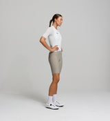 Side angle of porcelain women's summer cycling jersey – tailored performance fit with technical mesh along key heat zones, designed to wick sweat fast and keep the body dry during endurance efforts in the heat.