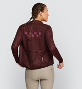 Essentials Women's Classic Jacket - Raisin, best waterproof winter windbreaker for rain and wind, model back view.