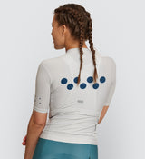 Back view of the Classic Cycling Jersey in Chalk, emphasizing the fit and silicone gripper bands that prevent riding up