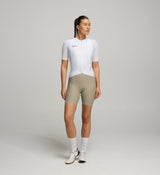 Front view of female cyclist in Core White Classic Jersey – extended sleeves, low-cut collar, and form-fitting silhouette designed for comfort and road performance.