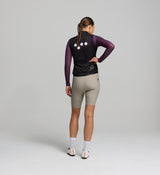 Rear image of black cycling gilet – three structured rear pockets, reflective logo, and breathable mesh construction designed for comfort, storage, and visibility on the road.
