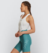 Side view of Women's SuperFIT 2.0 Bib Shorts in Evergreen, showcasing the seamless cuff and muscle support fabric