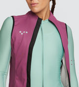 Closeup of Essentials Women's Thermal Gilet - Mulberry, a waterproof, windproof vest for all-weather, year-round cycling.