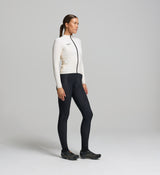 Side profile of almond long sleeve women’s cycling jersey – midweight construction, breathable thermal materials, and a tailored fit for layering beneath jackets or gilets.