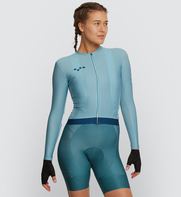 Front view of female cyclist wearing Twilight Classic Long Sleeve Cycling Jersey, showcasing breathable fabric and secure silicone hem