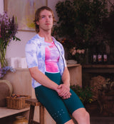 Side profile of Floral Men's Air Base Layer - Cosmos on model, revealing ergonomic cut and flatlock seams for all-day riding comfort