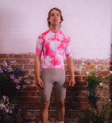 Model wearing Floral Men's Classic Jersey - Cosmos front view, highlighting form-fitting cut, low collar, and high-performance breathable fabric