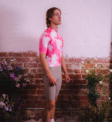 Side profile of Floral Men's Classic Jersey - Cosmos on model, showing four-way stretch and ventilation panels for enhanced movement and airflow