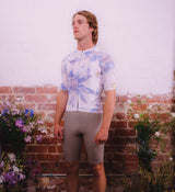 Side profile of Floral Men's Classic Jersey - Daisy on model, highlighting breathable side panels and four-way stretch for optimal mobility