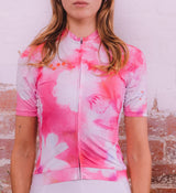 Close-up of Floral Women's Classic Jersey - Cosmos fabric and hem, showing silicone gripper and technical fabric texture for comfort and secure fit