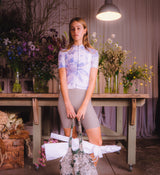 Model wearing Floral Women's Classic Jersey - Daisy front view, highlighting sculpted fit, moisture-wicking fabric, and low-cut collar for aerodynamic comfort