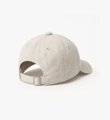 Pedla unisex stone beige cotton cap — peached twill, unstructured 6‑panel relaxed baseball cap with curved visor, adjustable buckle strap and subtle embroidered “Keep Pedalling” logo