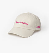 Cream unisex Pedla peached cotton twill cap — unstructured 6-panel cycling hat with curved visor, adjustable buckle and embroidered "Keep Pedalling" and Pedla logos