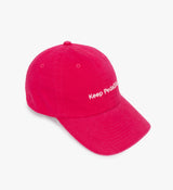 Fuchsia Pedla unisex peached cotton-twill cap — casual unstructured 6-panel cycling hat with curved visor, adjustable buckle closure and subtle embroidered "Keep Pedalling" logo