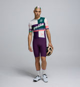 Front view of cyclist wearing the Multi Classic Jersey – extended sleeves, low-cut collar, and sleek colorful design