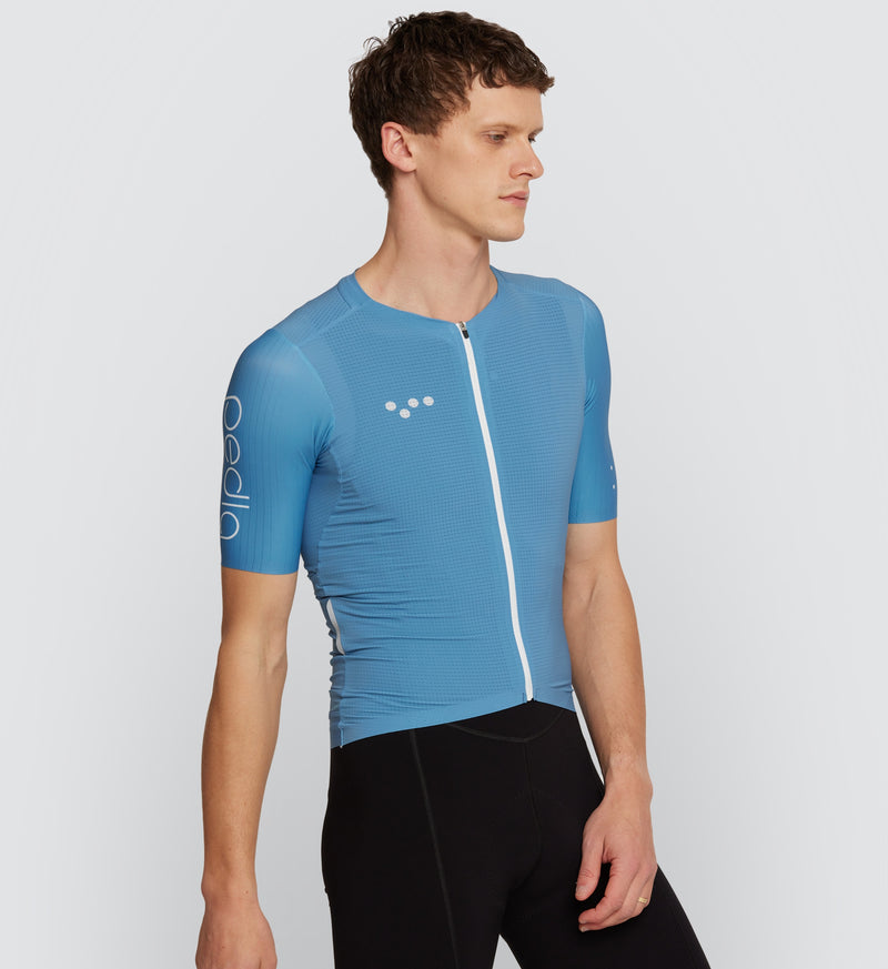 Front view of male cyclist wearing Slate Pursuit Air Jersey, featuring ultralight design and streamlined fit