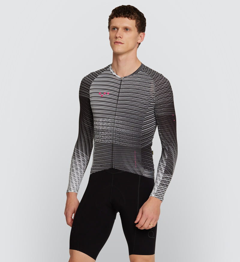 Front view of male cyclist wearing the Interweave Mono Pro Pursuit Long Sleeve 2.0 Jersey, showcasing race-ready fit and heat-welded sleeve hems