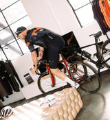 LOCAL LOOPS Men's Pro Air Gravel Suit Bubble Ink Shaun Riding in Shop