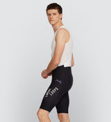 Side view of LOCAL LOOPS Men's SuperFIT 2.0 Cycling Bib Shorts in Club Team on model, highlighting the seamless, non-stitched cuffs, ergonomic fit, and high-quality Italian fabric for optimal muscle support and stability during long rides.