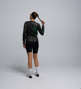 Back view of the Tech Tee with visible flatlock seams, UPF-rated fabric, and ergonomic panel structure.