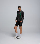 Side profile of the LS Technical Tee – Acid Black, highlighting relaxed shoulder fit and hydration tube channel.
