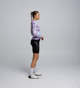 Side profile of long sleeve training jersey in Fade colourway, highlighting low-cut collar and articulated sleeve structure.