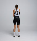 Back view of the Lost in Nature bib shorts showing reflective logo and structured back brace detail.