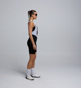 Side profile of black Women’s Training Bib Short, highlighting the breathable brace system and ergonomic paneling.