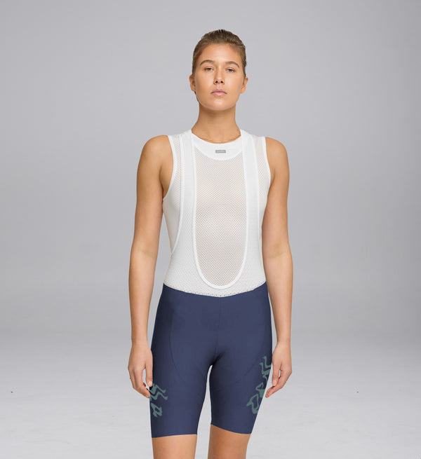Model wearing Pedla Women's Training Bib Short in Dusk – front view highlighting fit and sleek lines