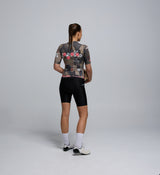 Back view of Pedla Training Jersey in Dusty – featuring three rear pockets, powerband hem, and recycled fabric with UPF 30+ protection