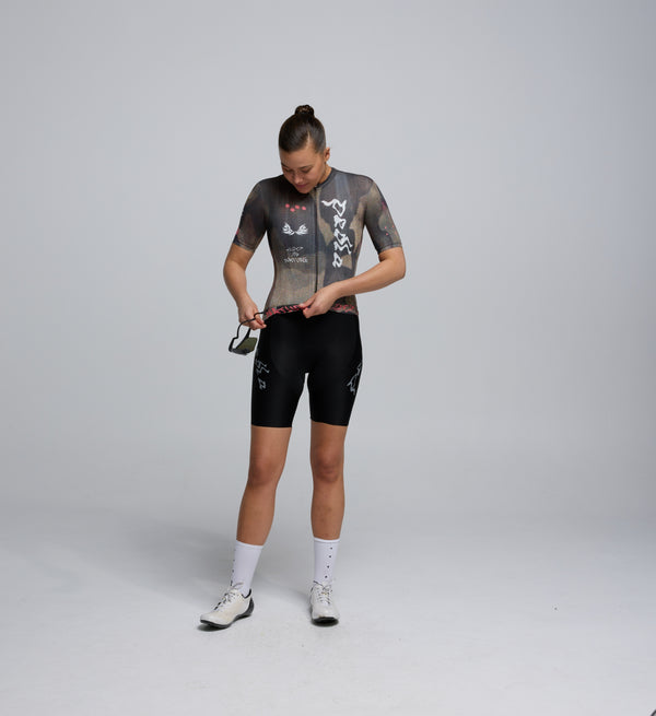 Female cyclist wearing Pedla Training Jersey in Dusty – showcasing tailored fit, extended sleeves, and breathable front panels for year-round riding comfort