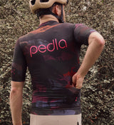 Close-up view of the NatureCAMO Men's Cycling Jersey in Acid on model, showing fabric details, UPF/SPF 30+ sun protection, and four-way stretch fit for moisture management and flexibility during bike rides.