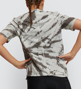 Back angle of Mono Tie Dye Off Grid Gravel Cycling Tech Tee worn by a cyclist, showcasing flat-lock seams for endurance on diverse terrains.