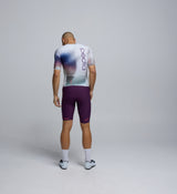 Back profile of the Men's Pro Pursuit Crit Suit in AirFoils White, featuring triple reinforced rear pockets, a contoured lower back fit, and leg grippers for secure all-day riding.